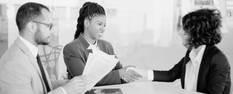 people discussing/signing contracts