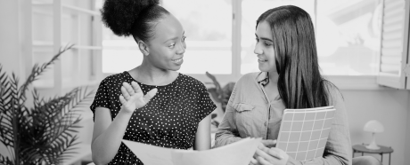 two women working together