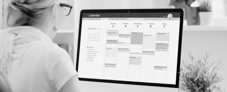 woman looking at scheudle on computer